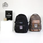 تصویر اختصاصی از نمای جلوی کوله پشتی مدرسه یونیک ۱۰۱۱ در رنگ قهوه‌ای مشکی