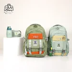 تصویر اختصاصی از نمای جلوی کوله پشتی مدرسه یونیک ۱۰۱۱ در رنگ سبز و سبز پاستیلی