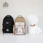 تصویر اختصاصی از دستهٔ کوله پشتی مدرسه زاندی ۳۶۴۱ در رنگ کرم مشکی