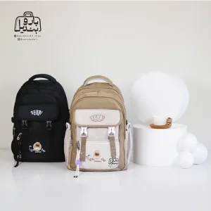 تصویر اختصاصی از دستهٔ کوله پشتی مدرسه زاندی ۳۶۴۱ در رنگ کرم مشکی